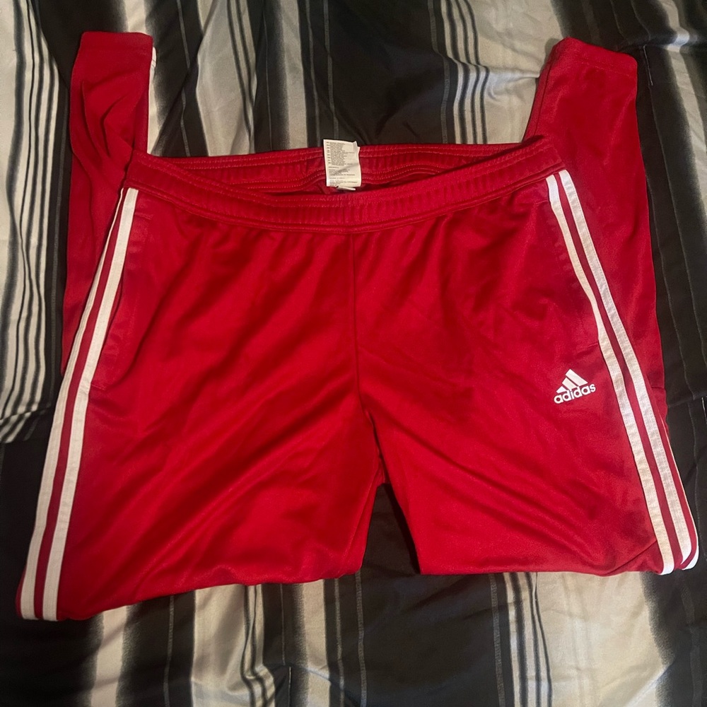 Red Adidas track pants